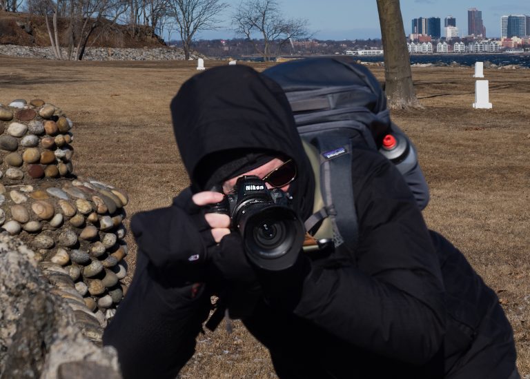 Image of Club Member Taking a Photo on Hart Island